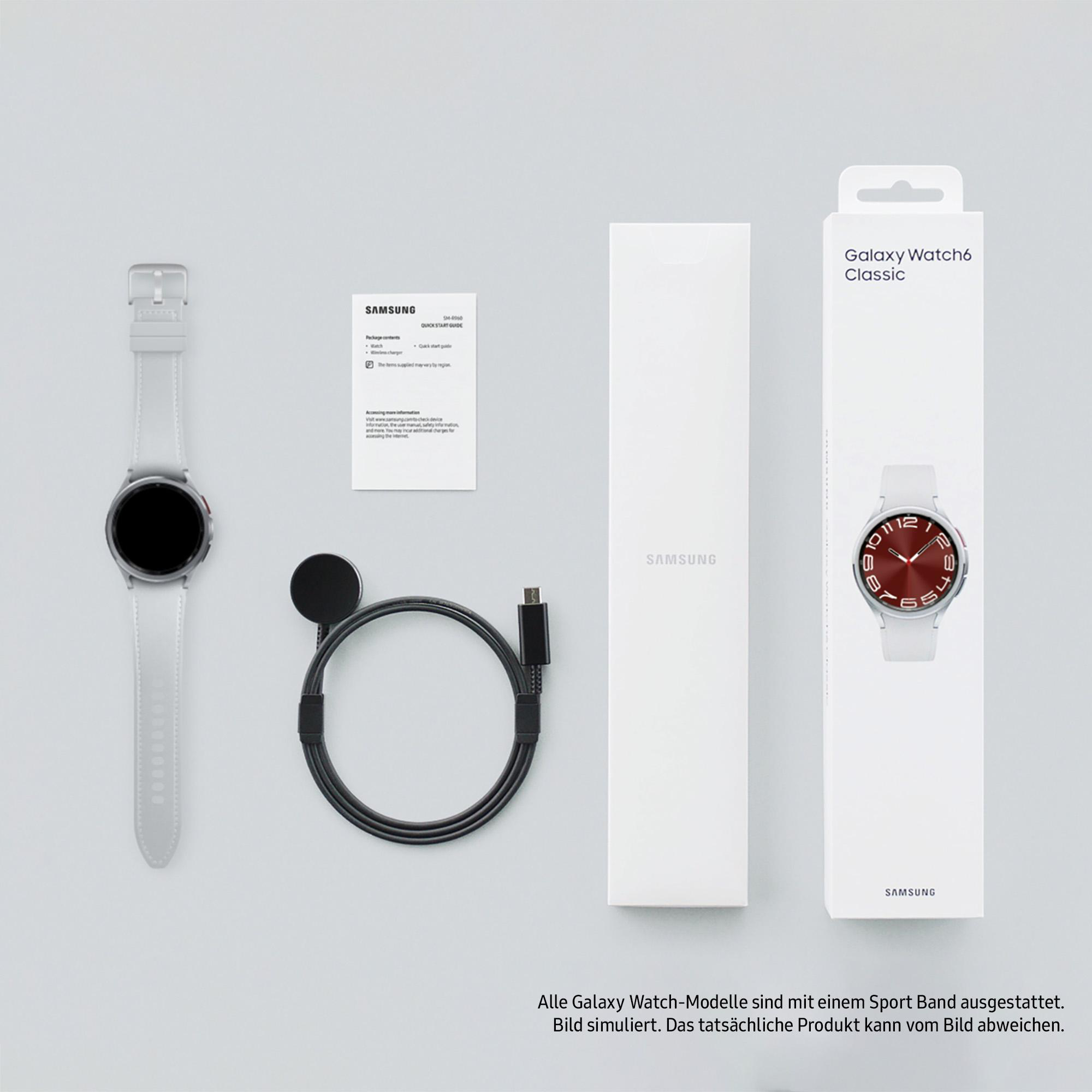 Uhr, Ladegerät, Kabel und Box mit Galaxy Watch6 Classic.