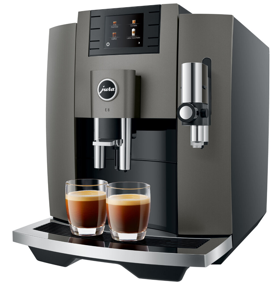 Ciemnoszara maszyna do kawy z dwiema szklankami kawy z przodu. Posiada ekran dotykowy i chromowany wylew.