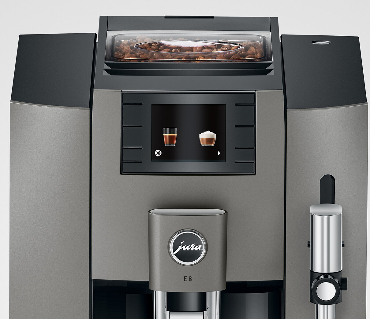 Ekspres do kawy z ekranem pokazującym opcje kawy. Posiada pojemnik na ziarna i wylew.