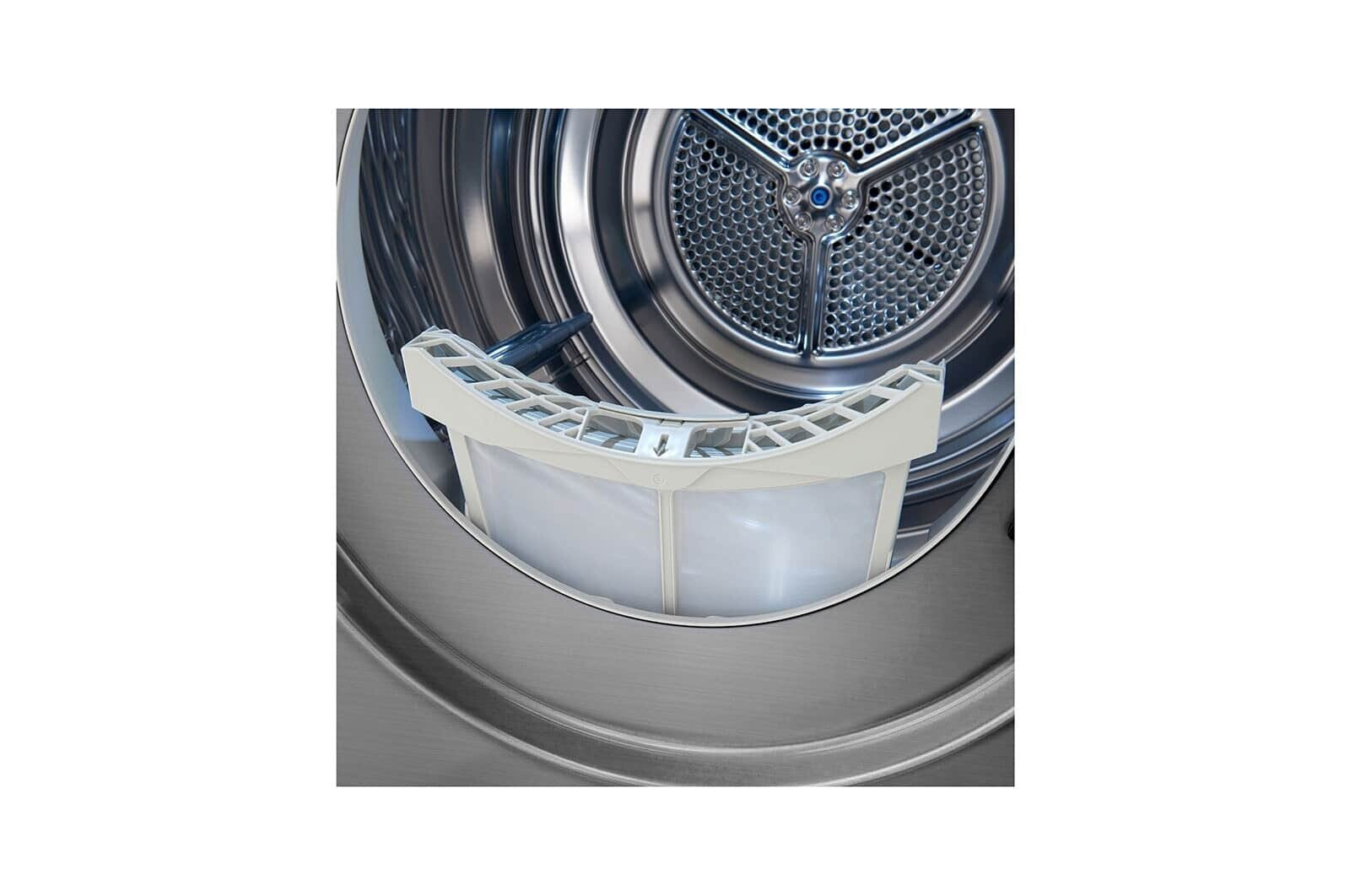 Wewnątrz suszarki widoczny jest biały filtr, otoczony metalowym wnętrzem.