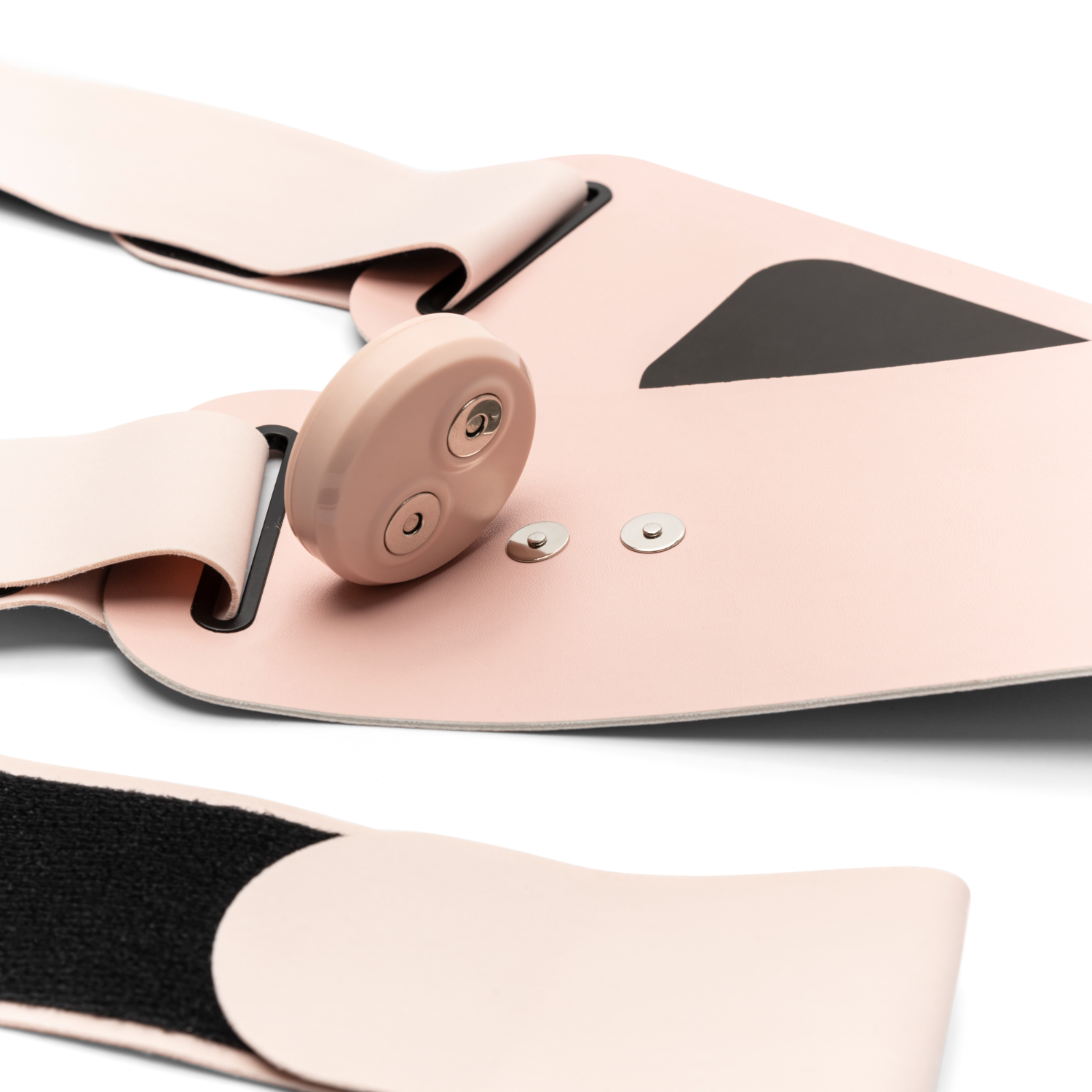 Pink medical device with straps and a round button on white.