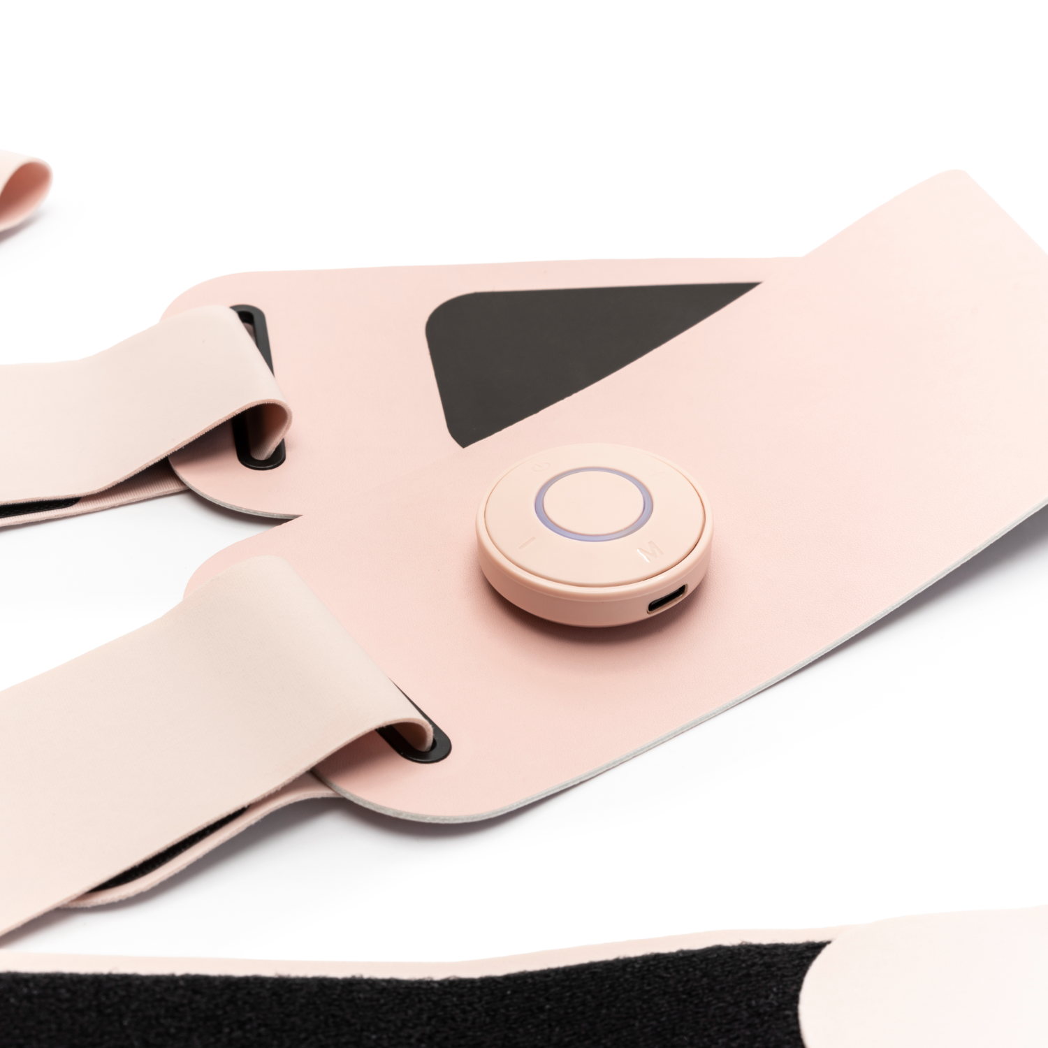 Pink EMS device with a central control unit and straps, isolated on white.