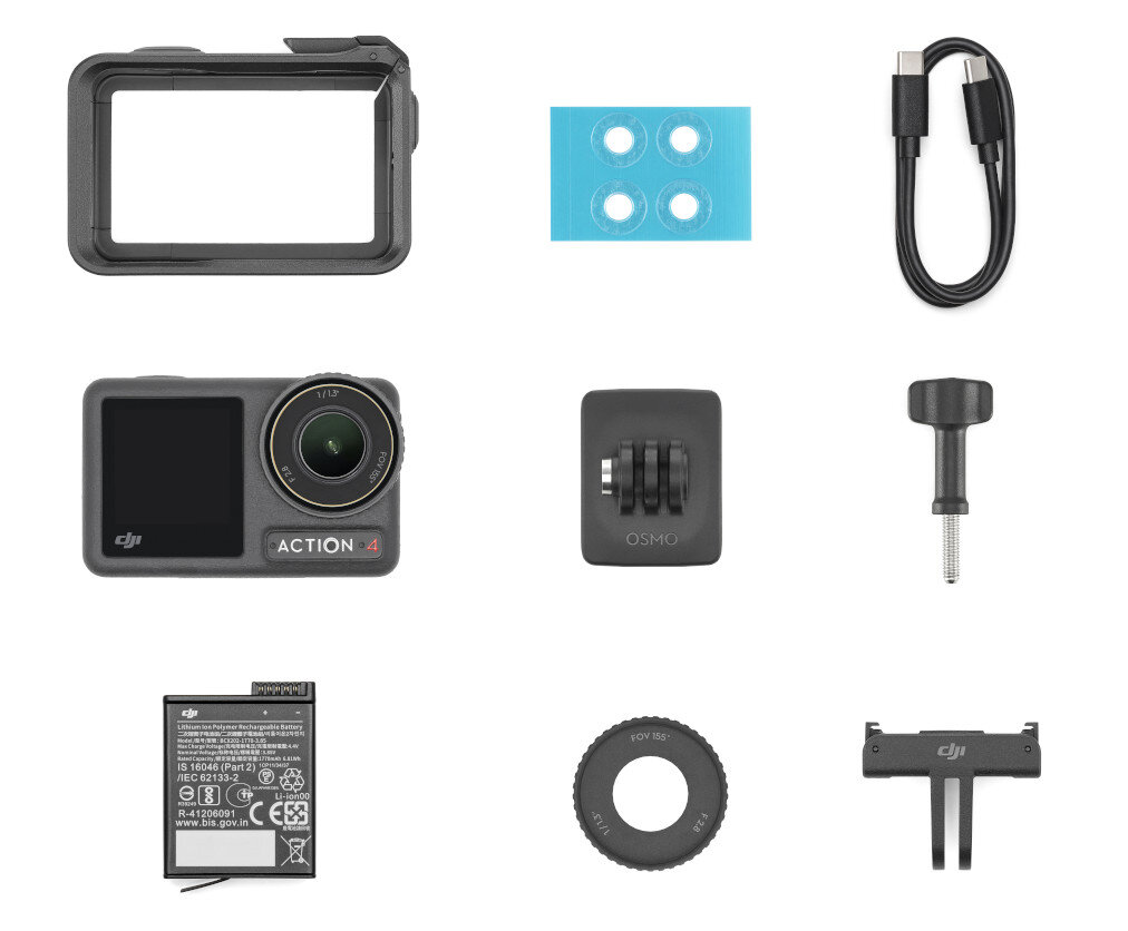 Kolekcja akcesoriów do aparatu. Zawiera aparat, ramkę i inne małe części.