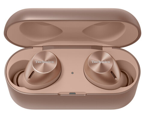 Różowe złote słuchawki Technics w otwartym etui. Etui i słuchawki są w kolorze różowego złota. Słuchawki mają logo Technics.