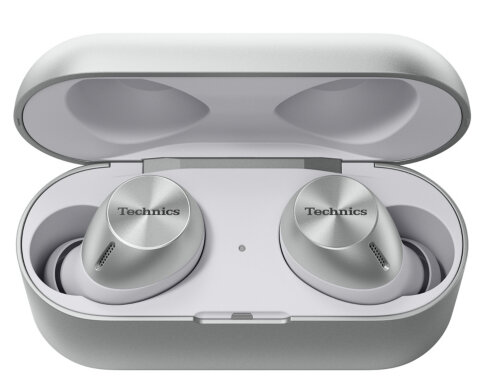 Białe słuchawki w otwartym, białym etui ładującym. Widoczne logo 'Technics'.