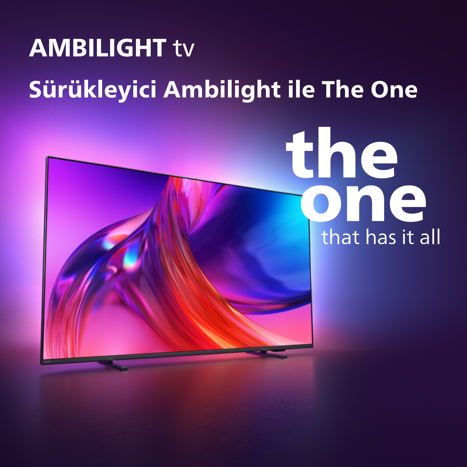 Renkli ışıklar gösteren TV, 'the one that has it all' yazısıyla.