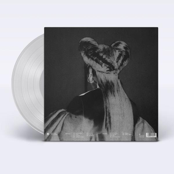 Eine transparente Vinylplatte und Hülle mit einer Frauensilhouette auf dem Cover.
