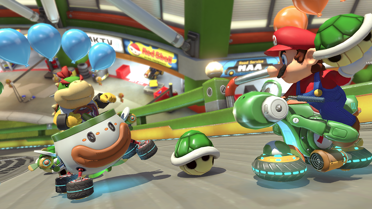 Mario and Bowser Jr. on go-karts racing. Balloons and shells are in the air.