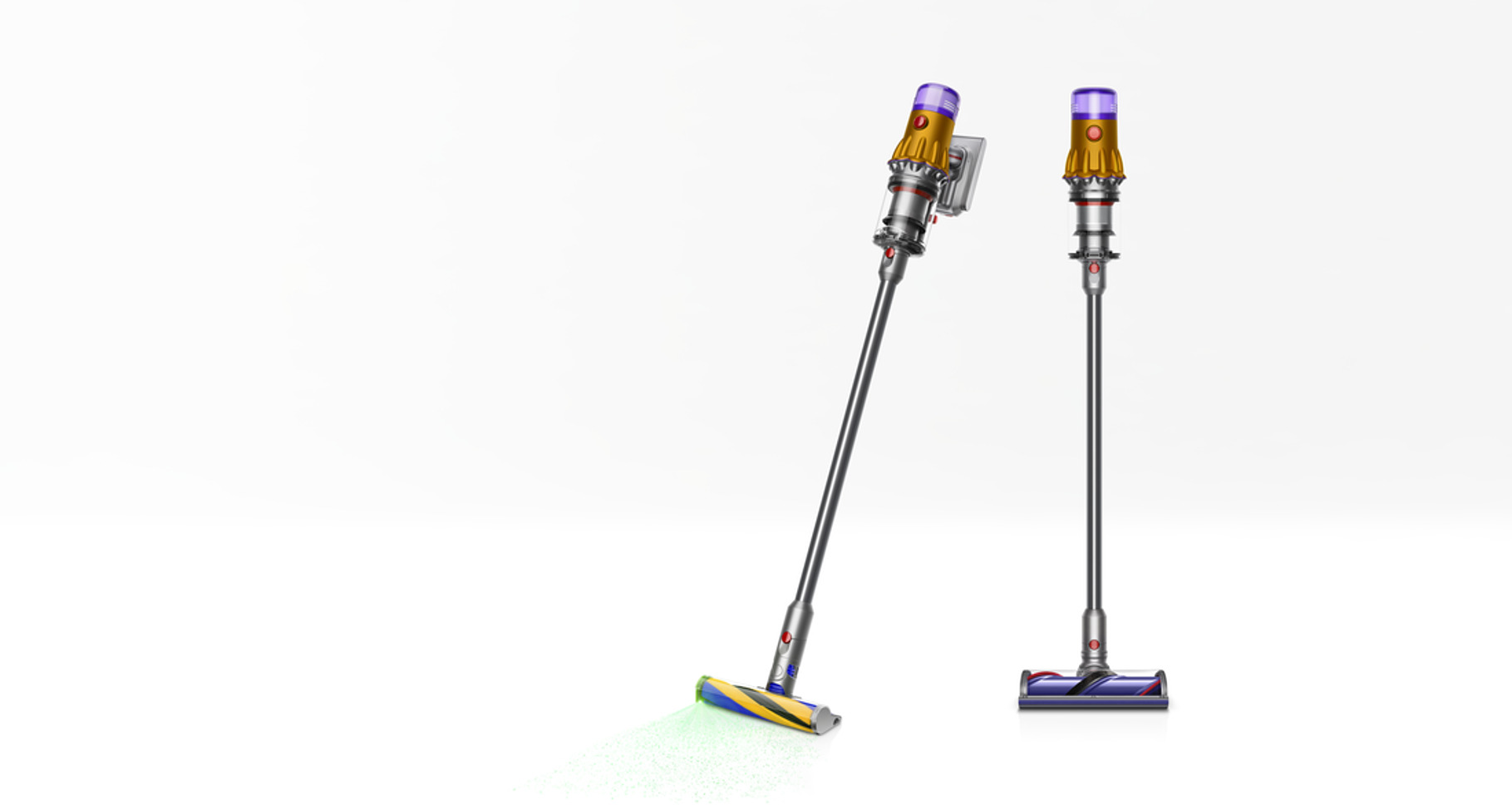 Dos aspiradoras Dyson sin cable. Una vertical, otra inclinada. Ambas amarillas y plateadas.