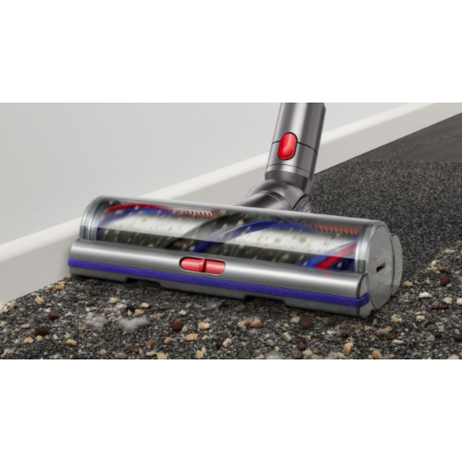 Vacuum cleaner head cleaning a carpet. Brush head with red and blue bristles, grey body, and white trim.