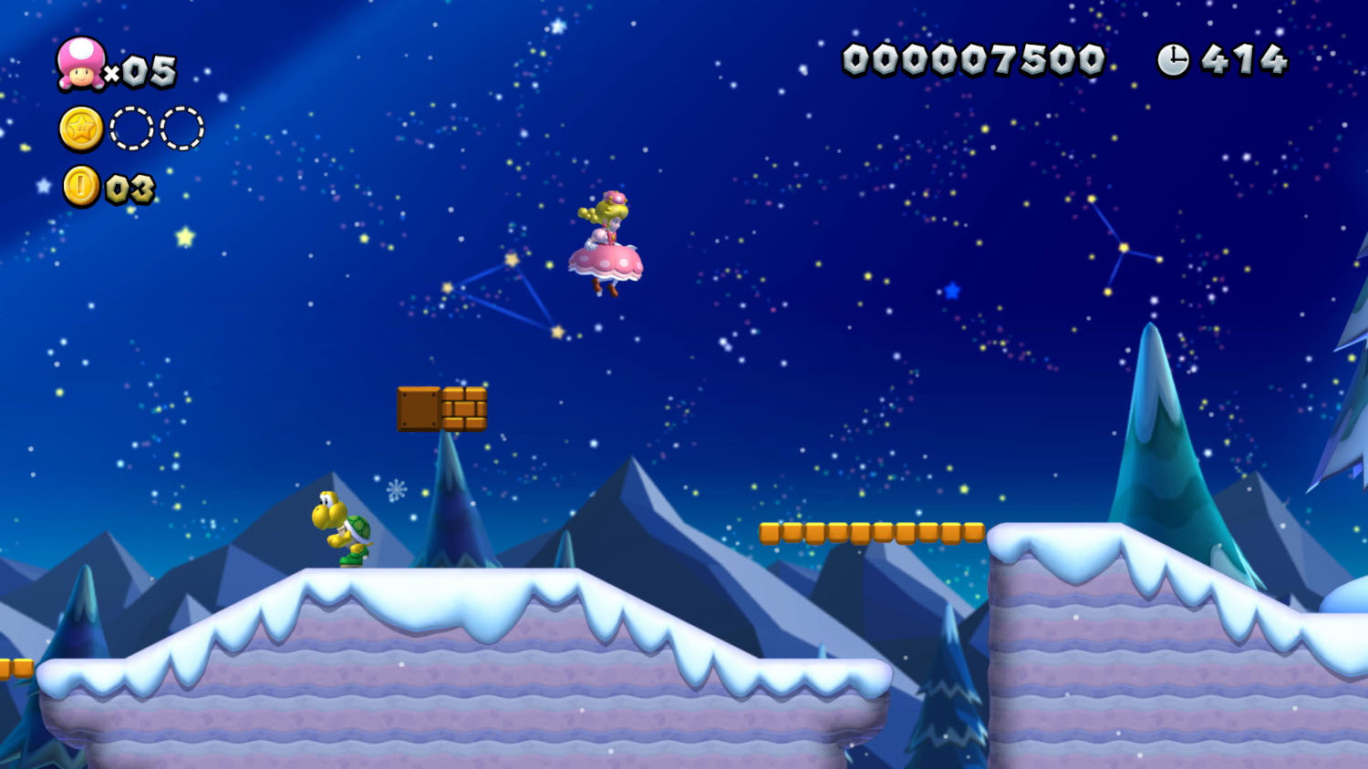 Een Mario spelscène met een roze personage dat over platforms springt.