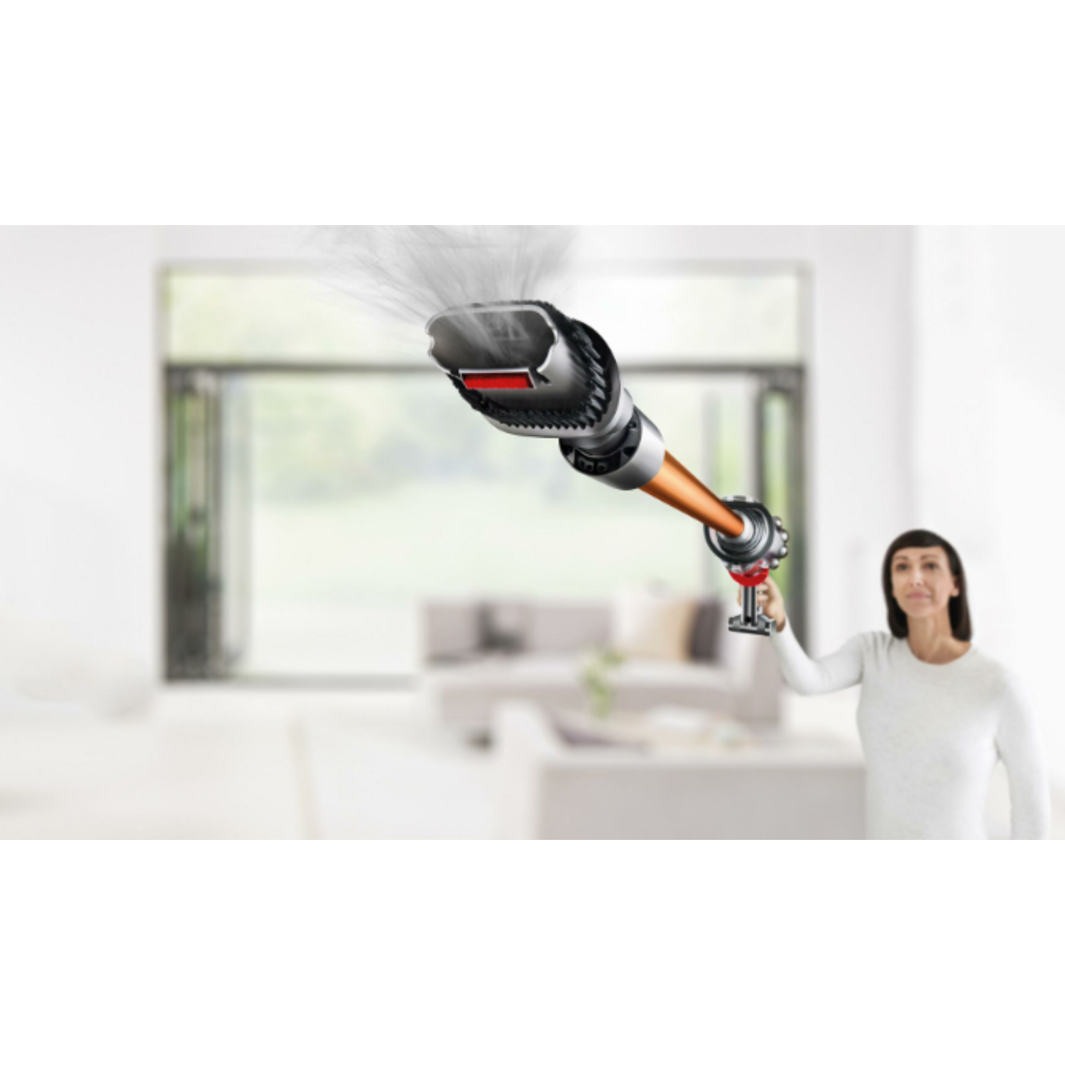 A woman using a vacuum cleaner, with a blurred background of a bright living room.