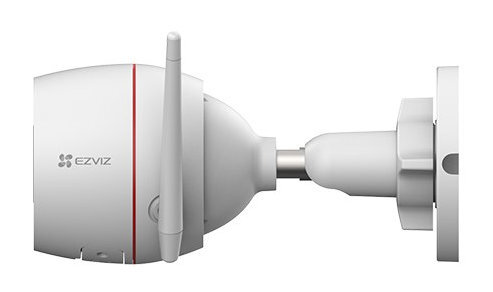 Biała kamera bezpieczeństwa z anteną. Jest zamontowana na ścianie.