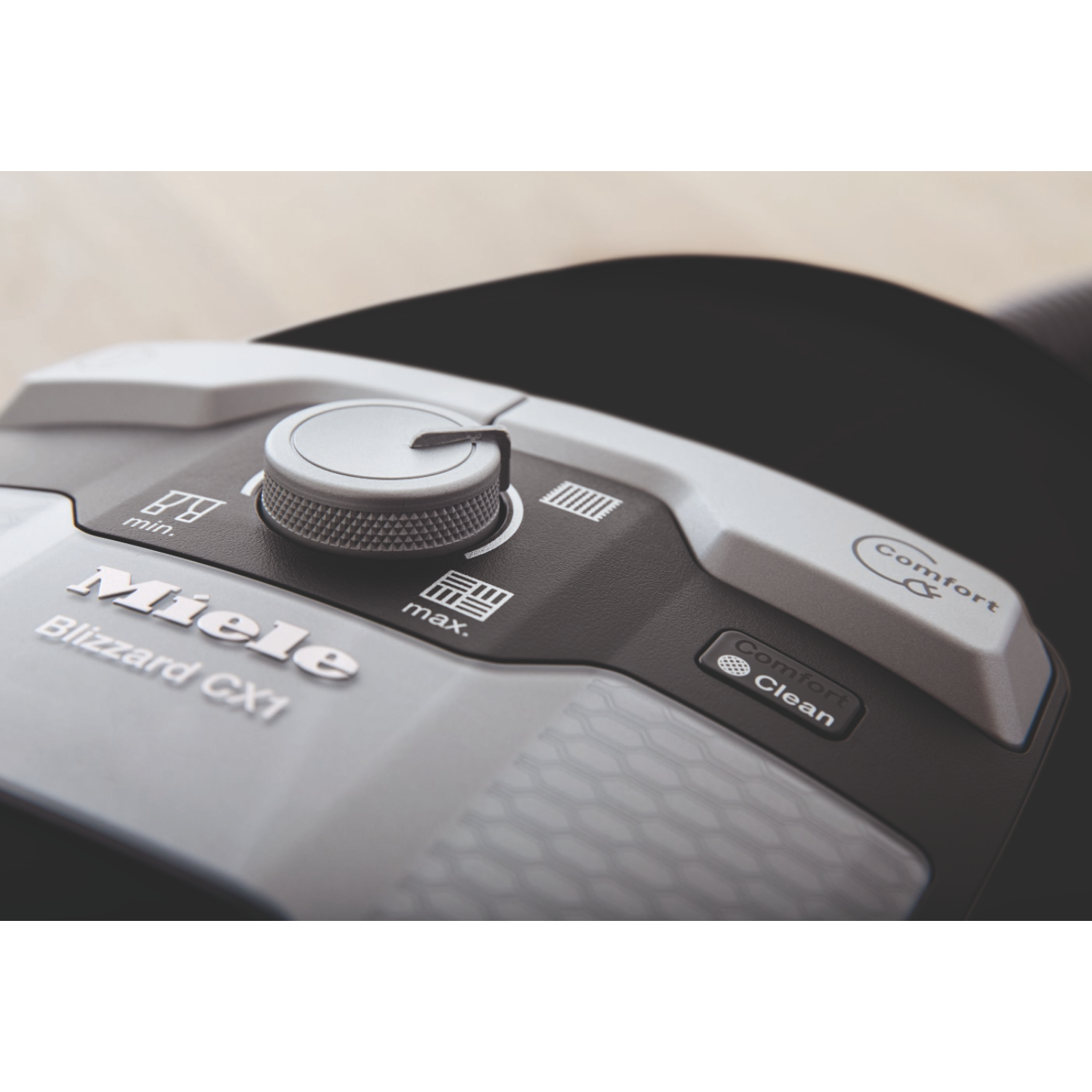 Close-up of a Miele Blizzard CX1 vacuum cleaner's control panel.