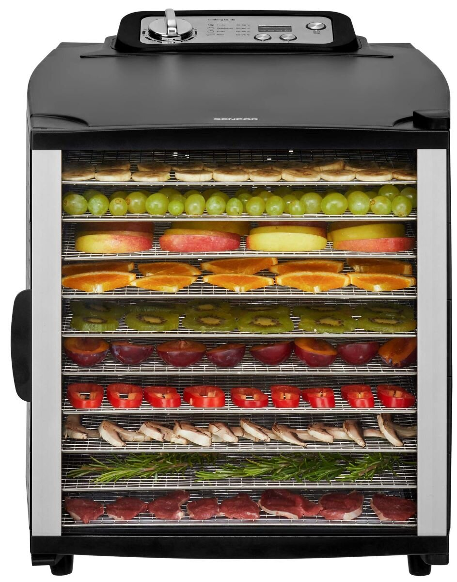 Czarny dehydrator żywności z różnymi warstwami suszonych owoców i warzyw.