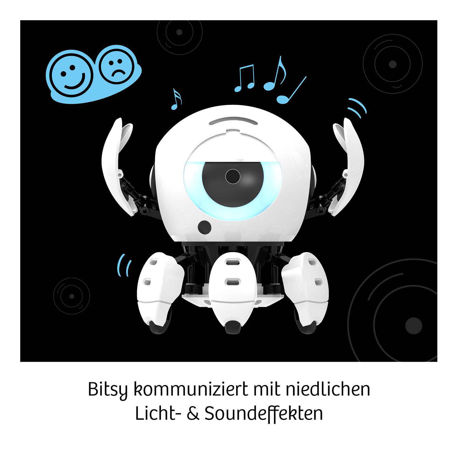Ein weißer Roboter mit Armen und Beinen, der Licht und Musik aussendet.