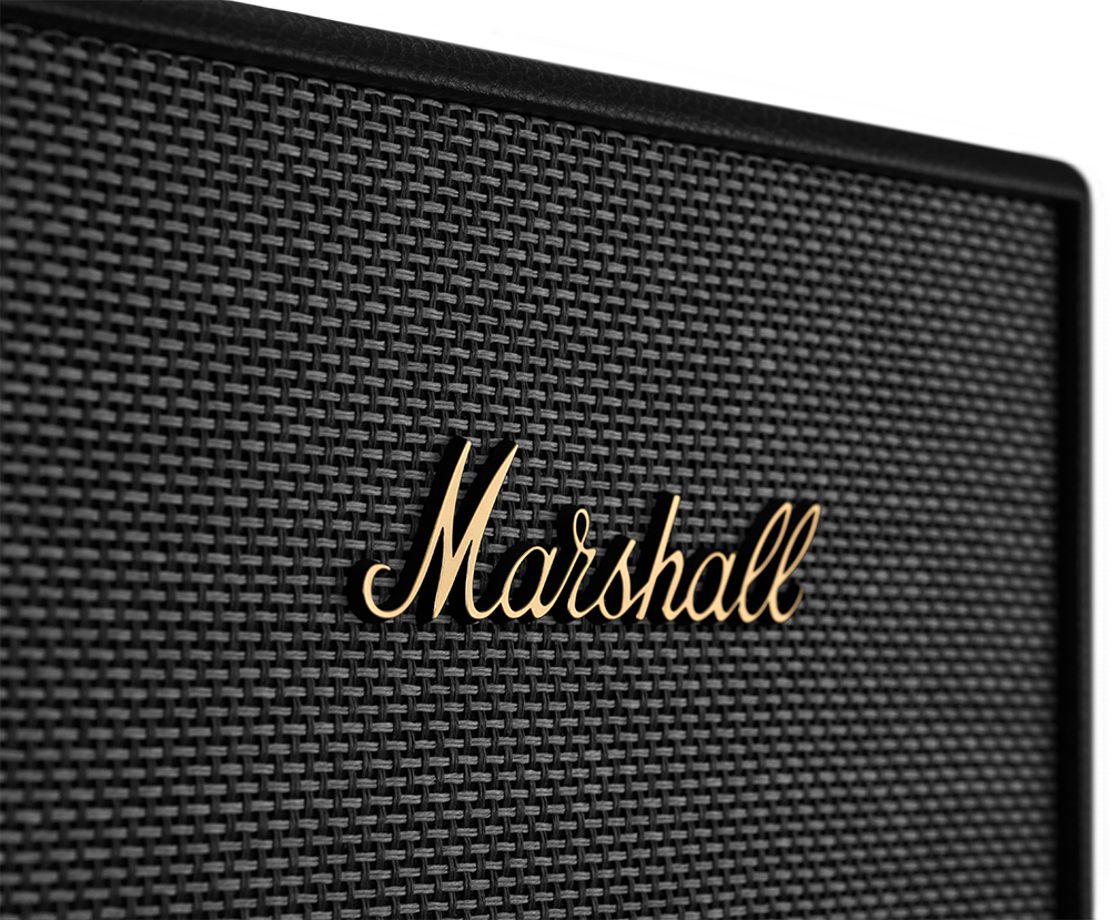 Close-up of a Marshall speaker grill with the Marshall logo in gold lettering.