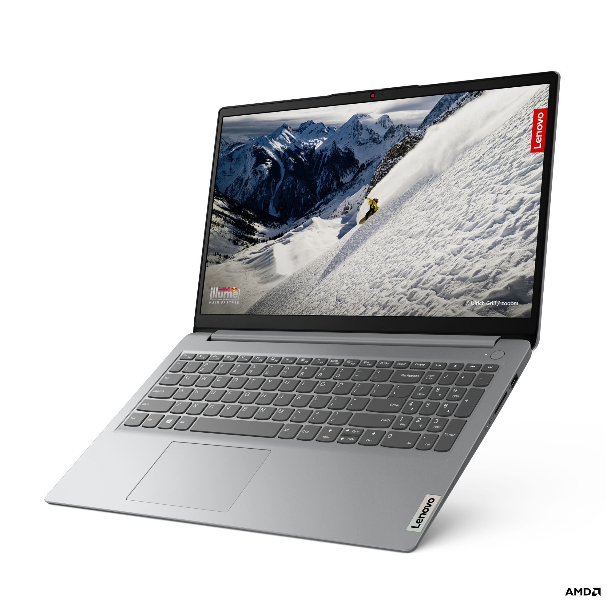 Gümüş renkli Lenovo dizüstü bilgisayar. Ekran, karlı bir dağ manzarasını gösteriyor.