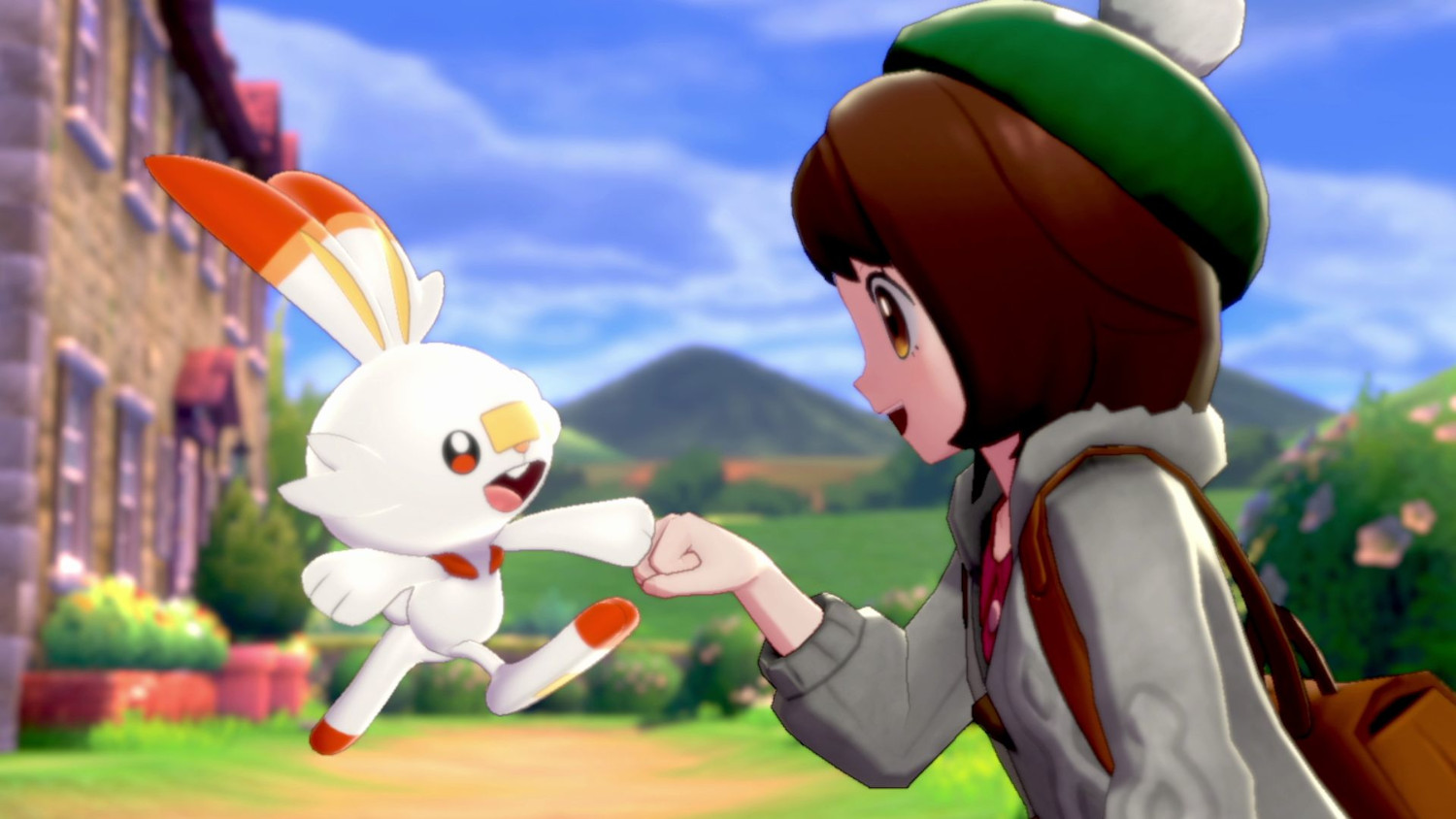 Een meisje dat een vuist maakt met een Scorbunny-personage in een zonnige buitenomgeving.