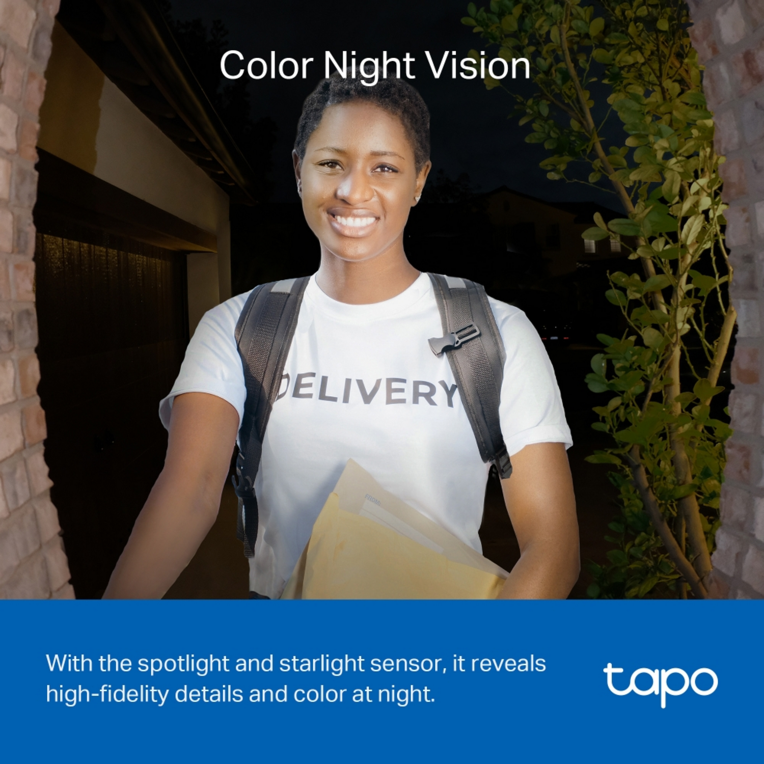 Woman delivering package at night, standing in doorway, wearing "DELIVERY" shirt.