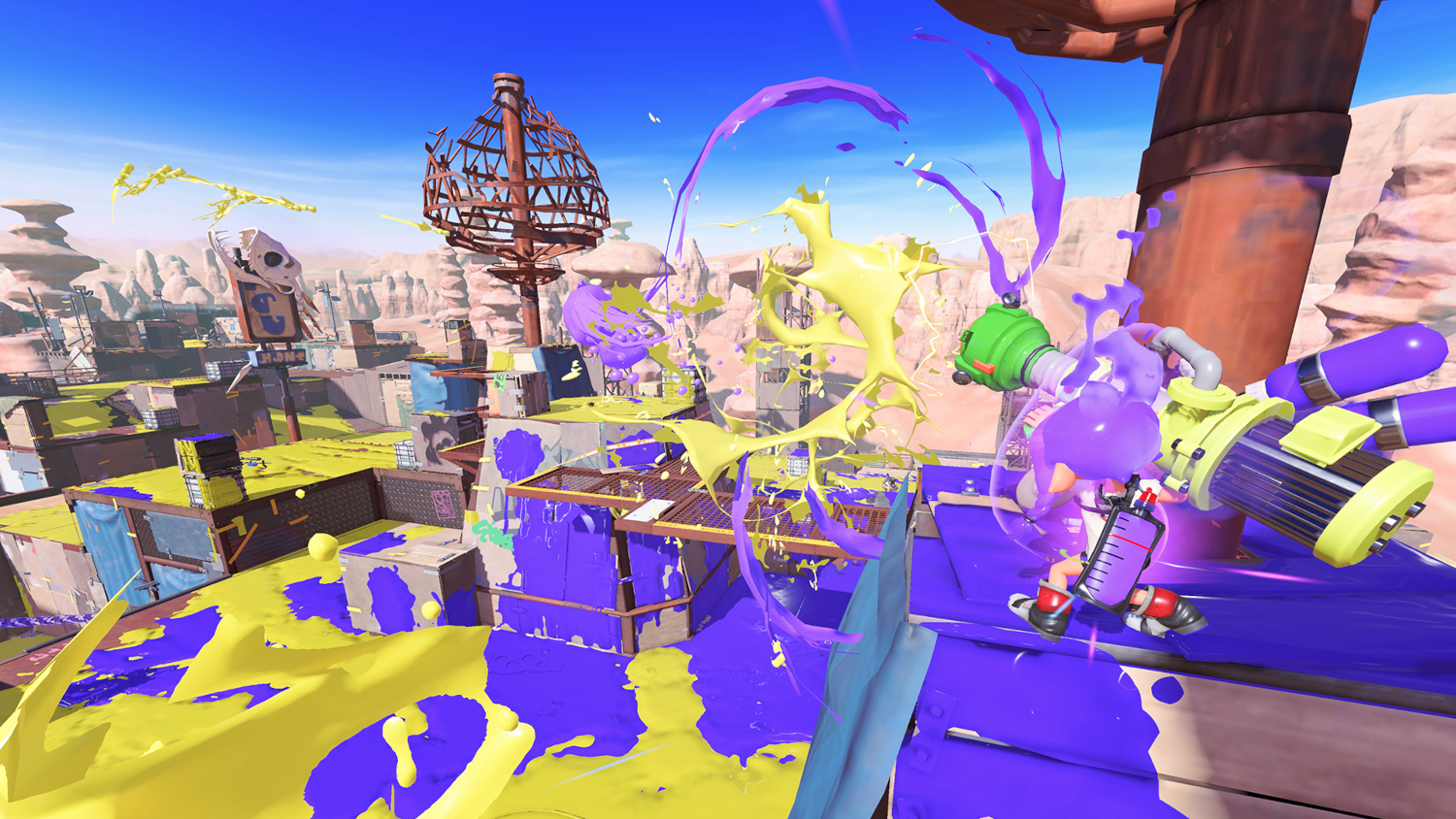Een spelscène met gele en paarse verfspetters op een platform.