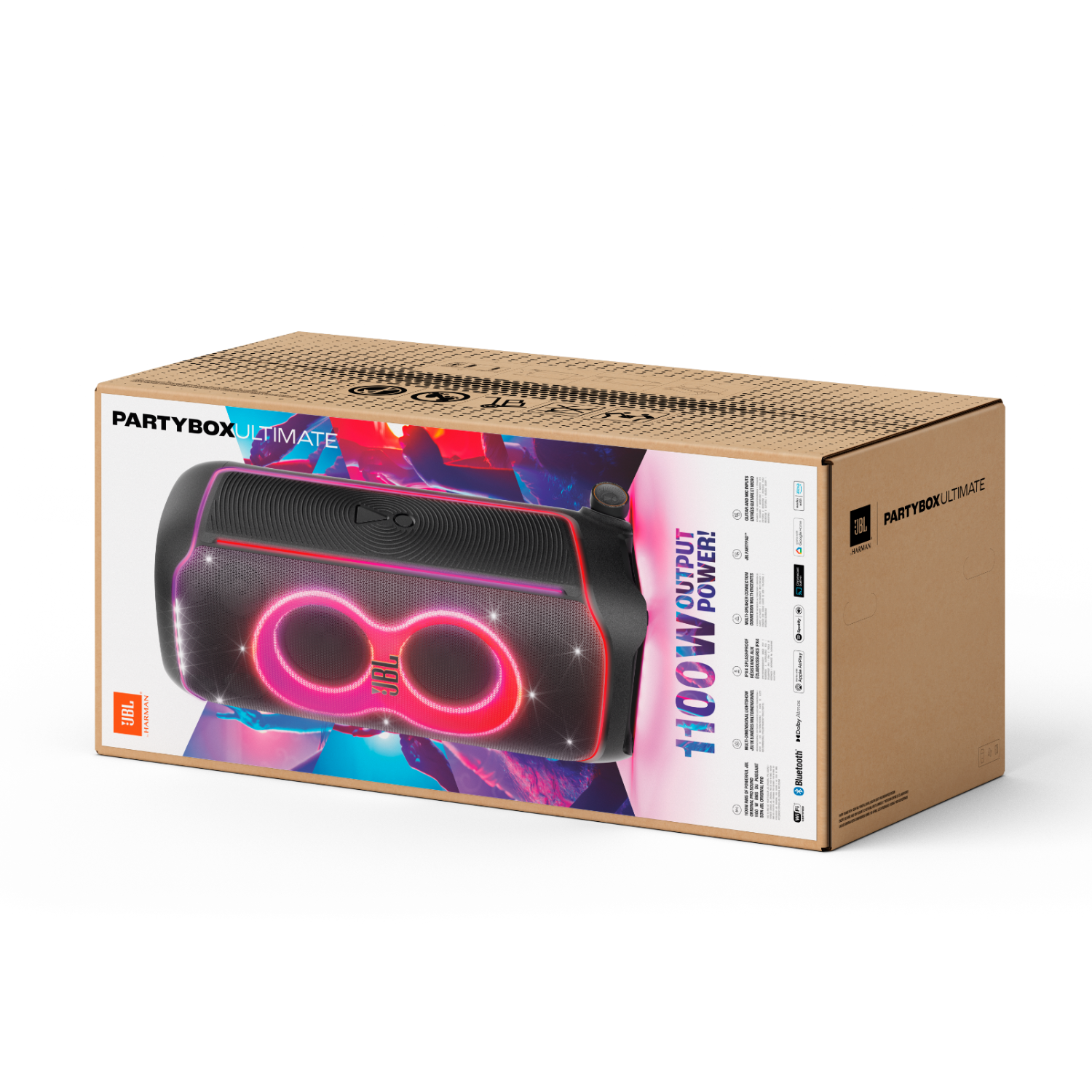Een JBL PartyBox Ultimate-luidspreker in de kartonnen doos, met reclametekst zichtbaar.