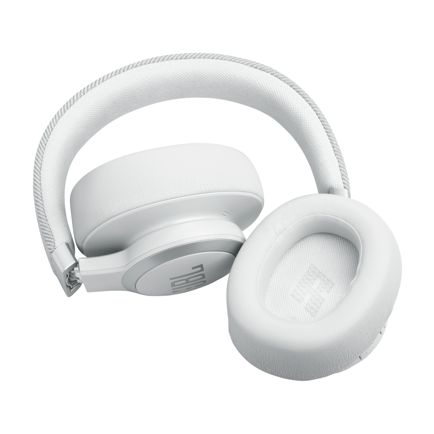 Weiße JBL Kopfhörer mit einem Bügel, der auf einer Oberfläche liegt.