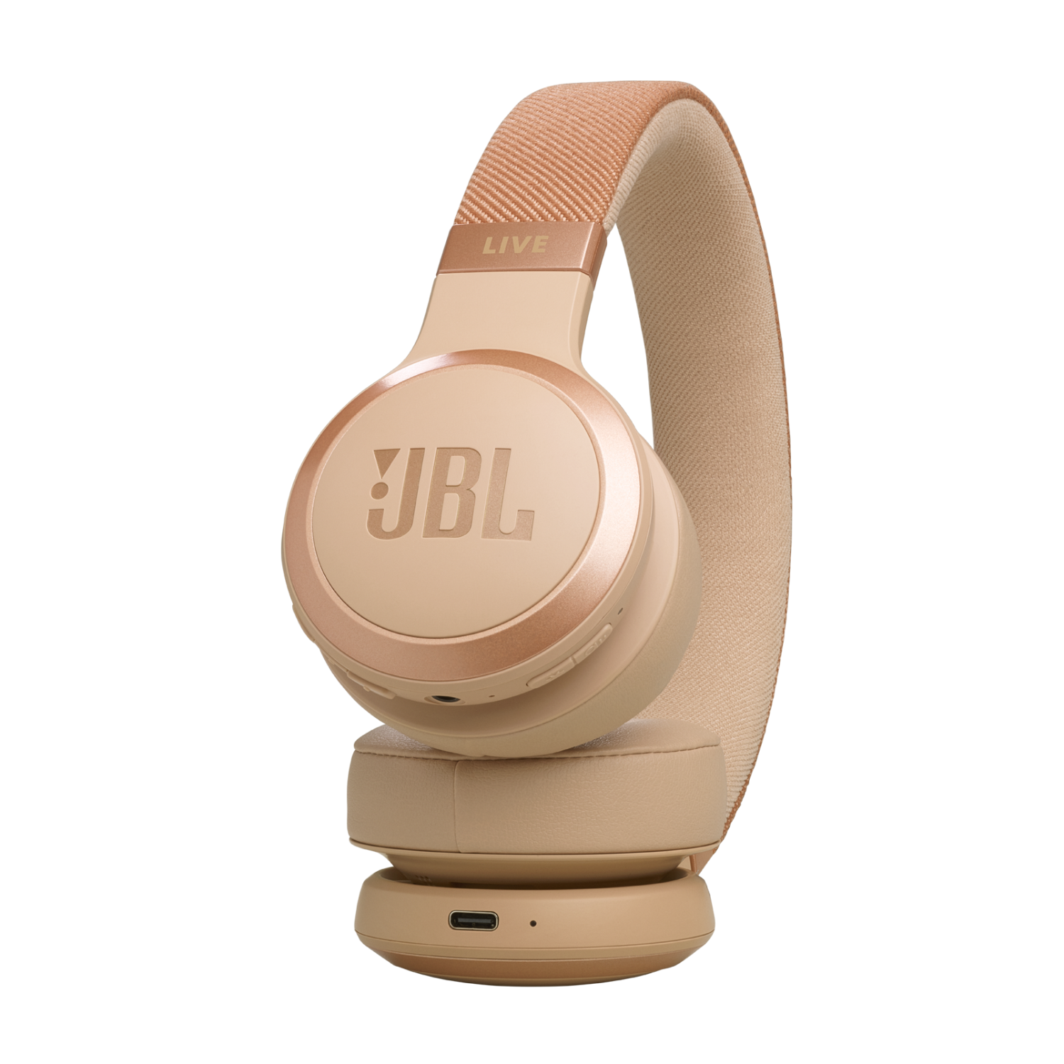 Beige JBL Live headphones on a black background. Side view.