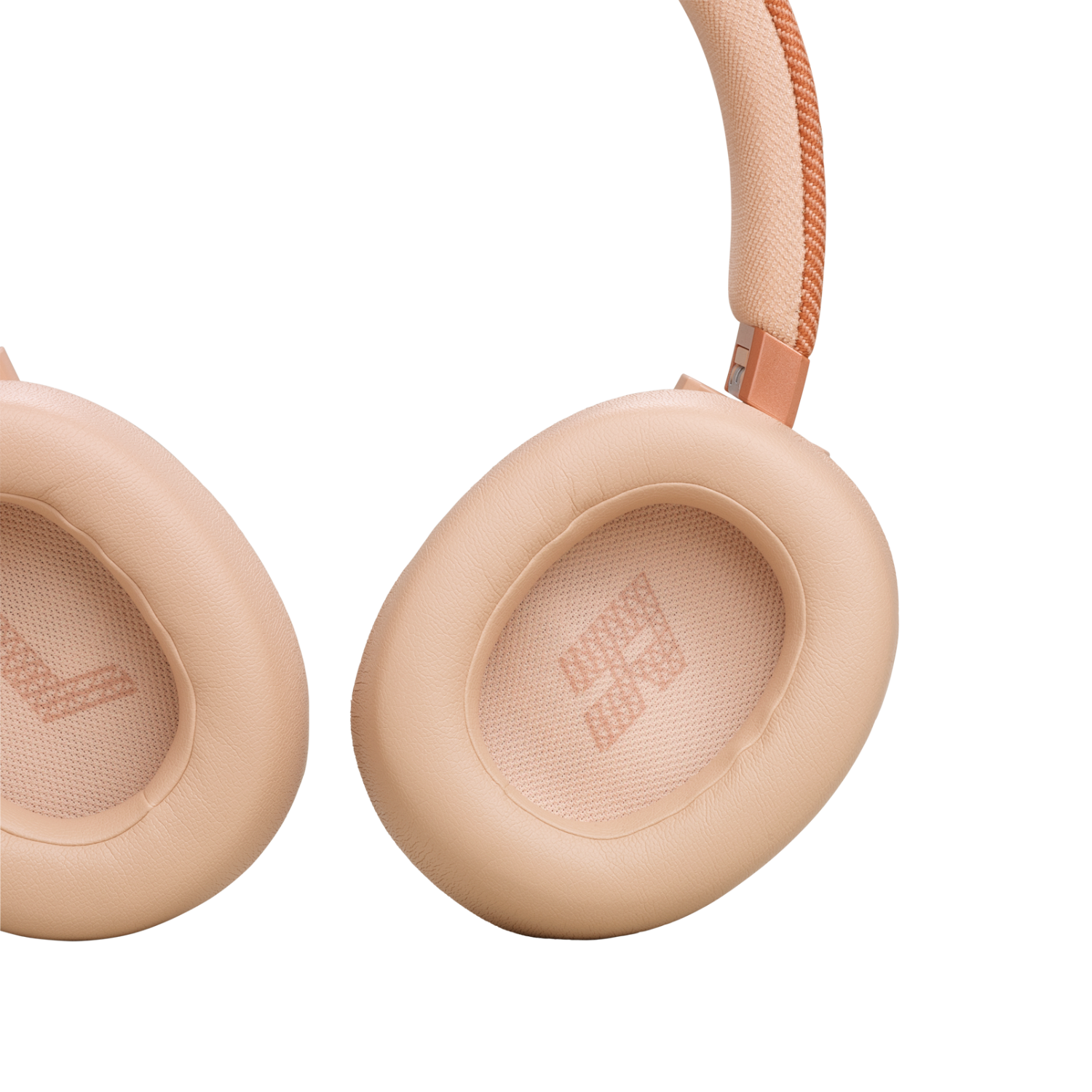 Hoofdtelefoon met roze oorschelpen. De oorschelpen zijn rond, de band is beige en roze.