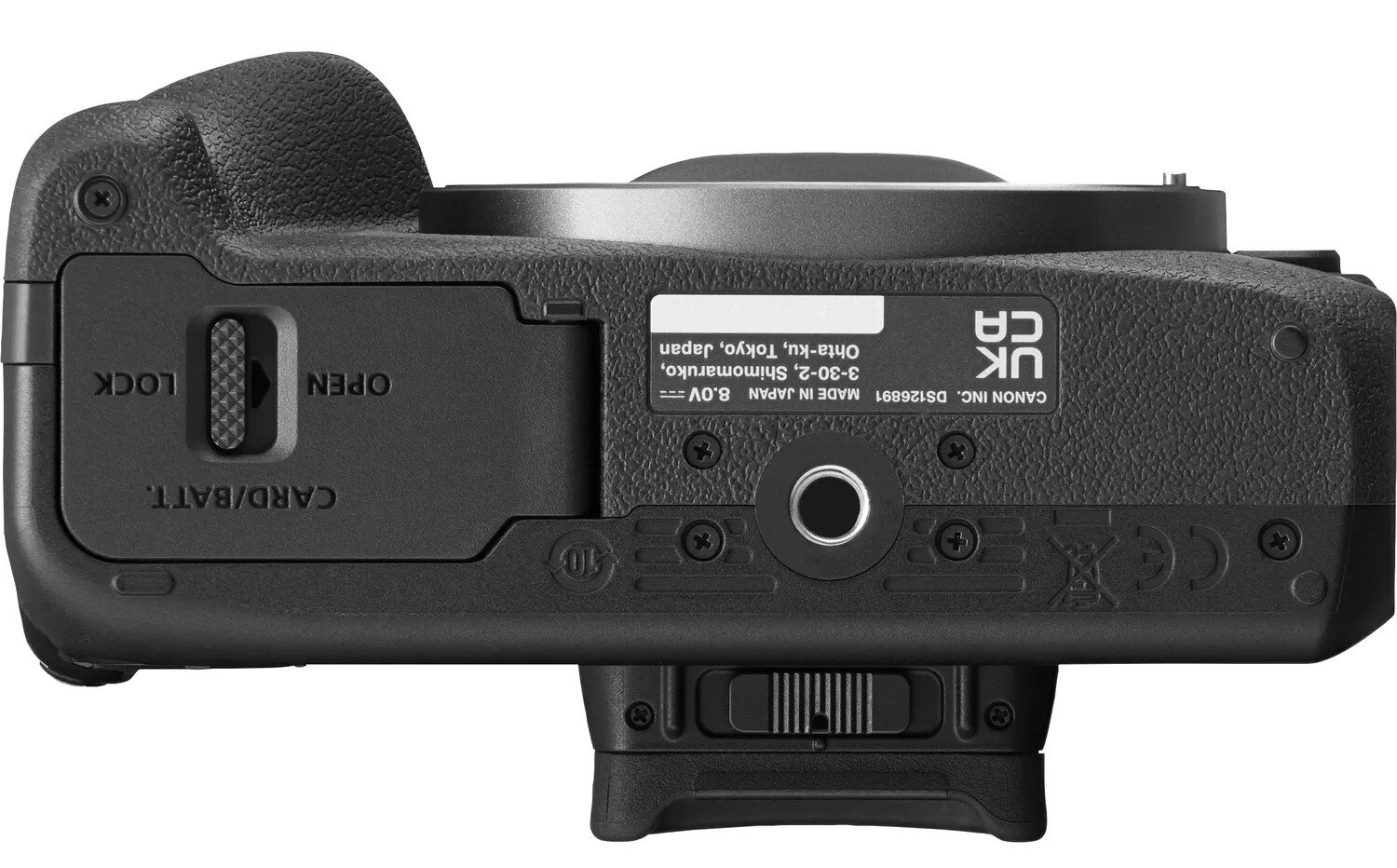 Spód czarnego aparatu z etykietami.