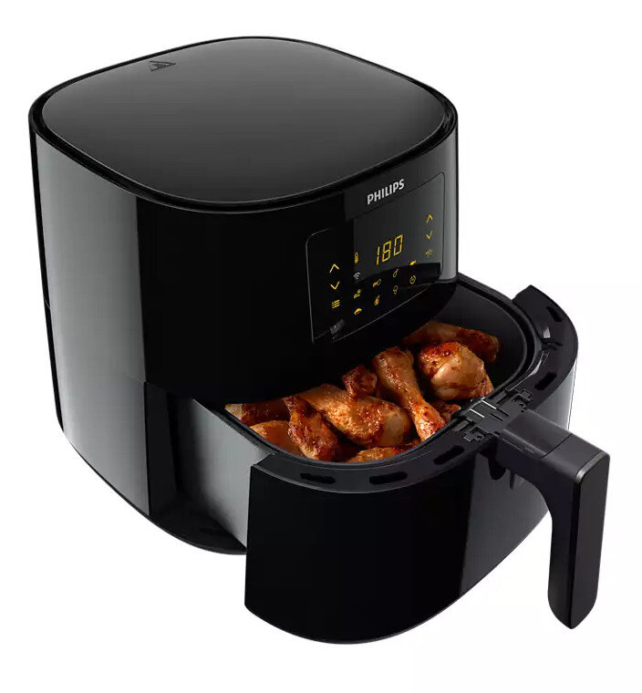 Czarna frytownica powietrzna Philips z otwartą szufladą, ukazująca ugotowane pałki z kurczaka. Panel sterowania pokazuje 180 stopni.