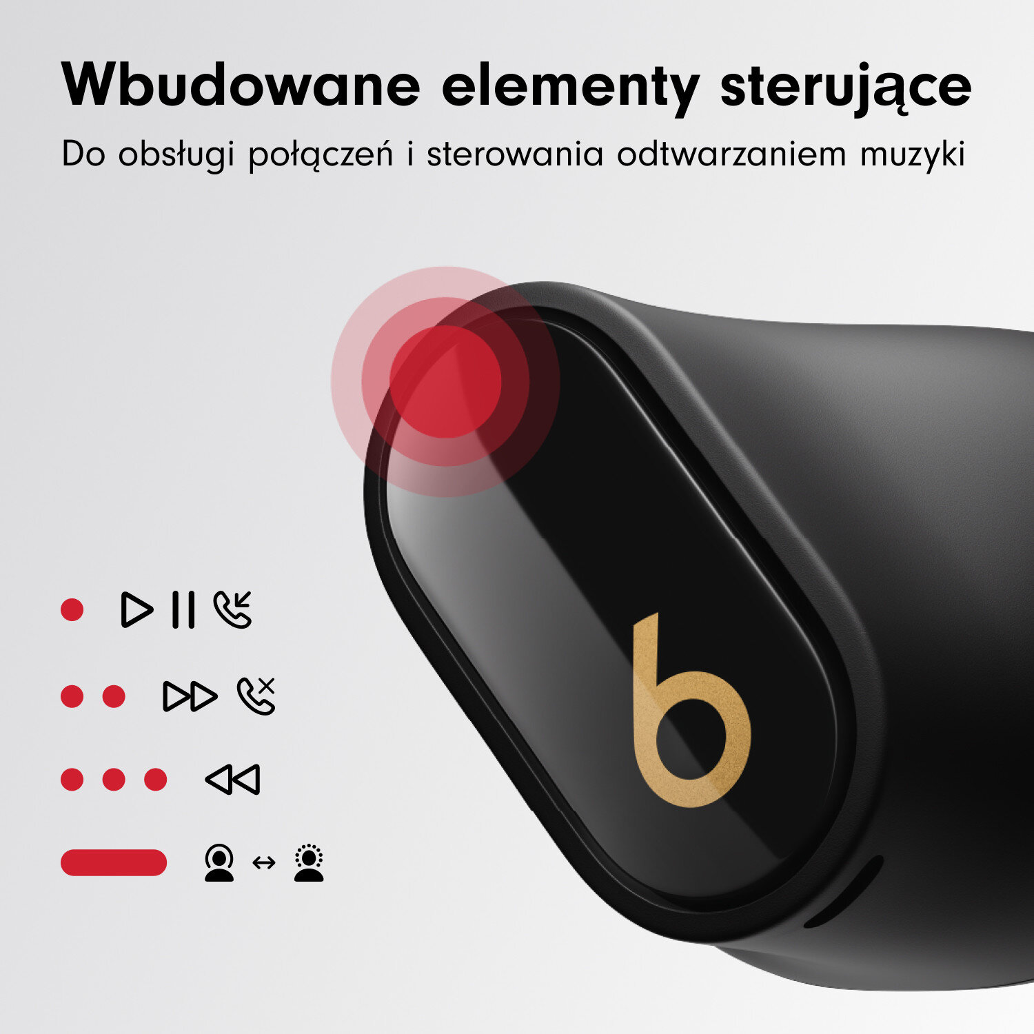 Zbliżenie czarnych słuchawek dousznych ze złotym logo 'b'. Sterowanie dotykowe jest wskazane czerwonymi okręgami i symbolami.