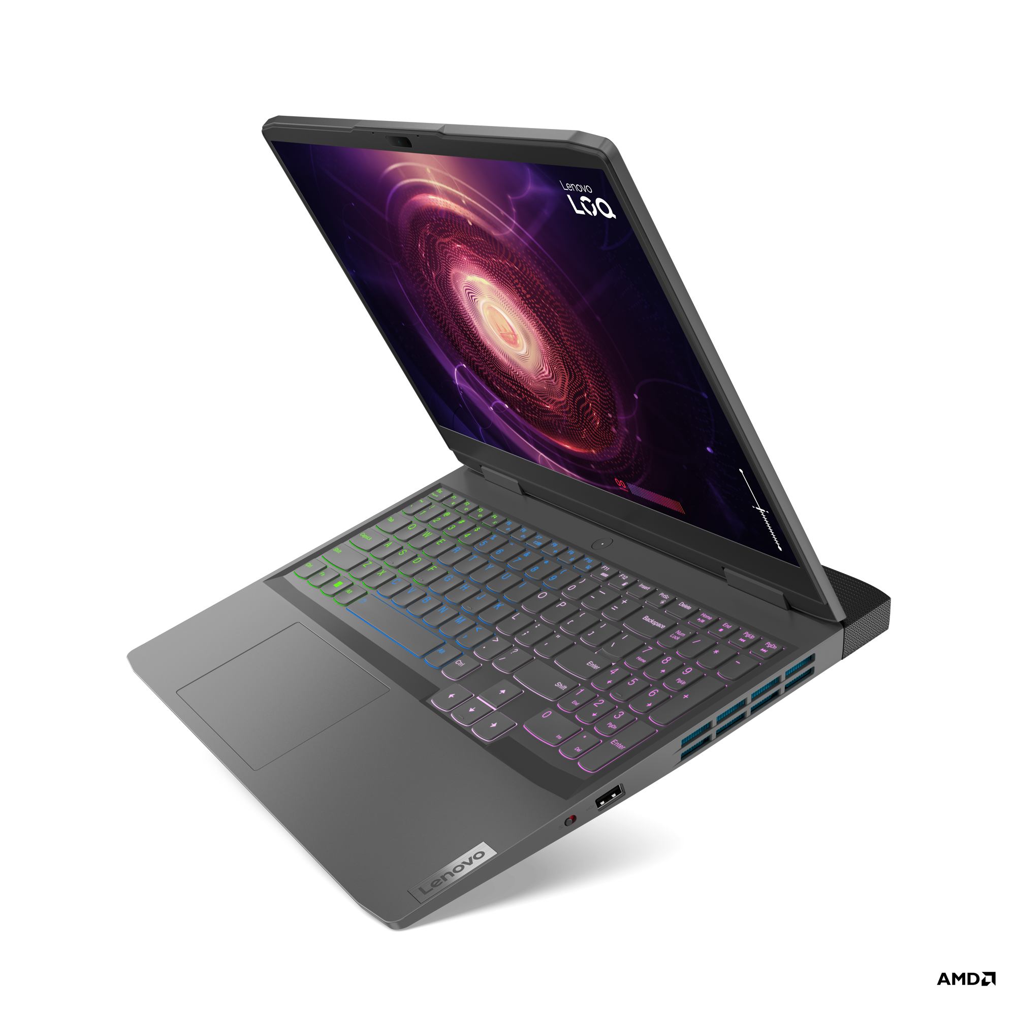Renkli bir klavyeye sahip gri bir Lenovo dizüstü bilgisayar, siyah bir yüzeyde açık.