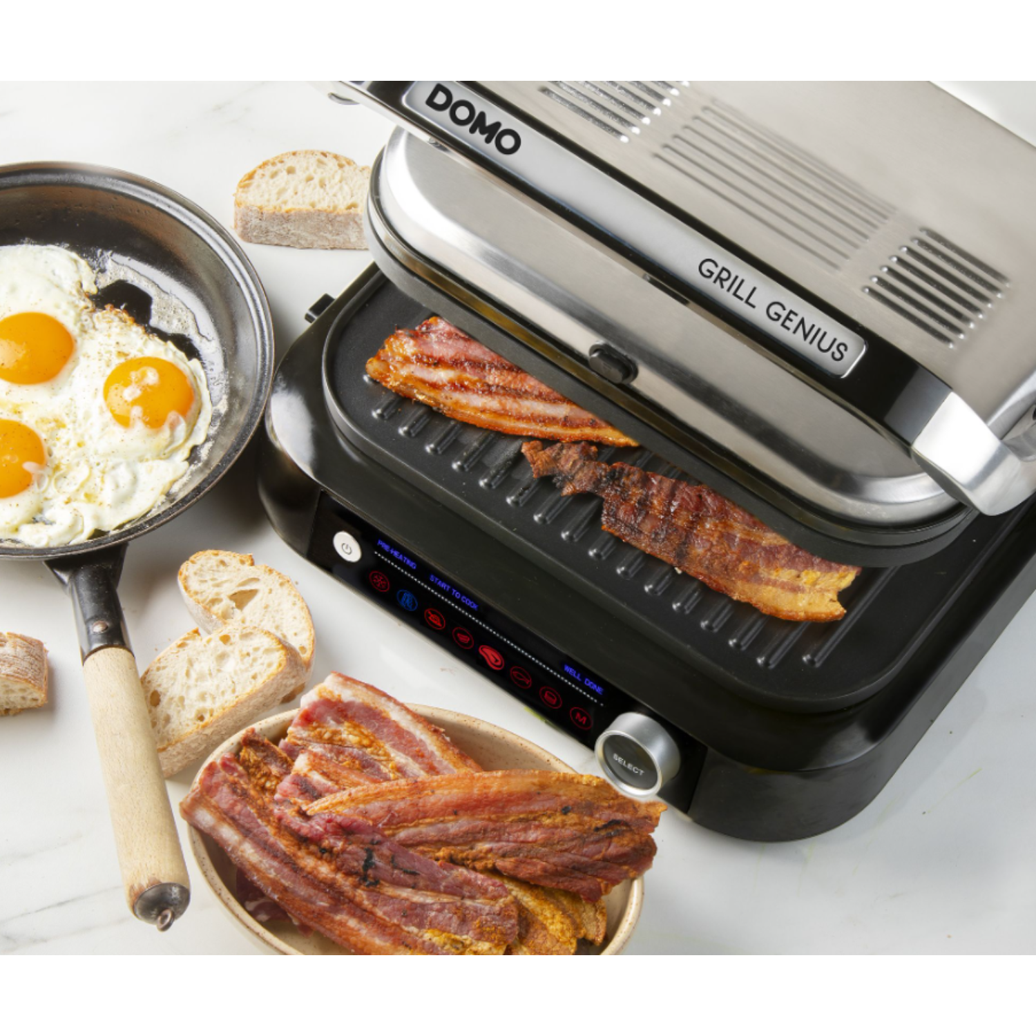 A grill with bacon cooking, eggs, and bread, with the word, Grill Genius.