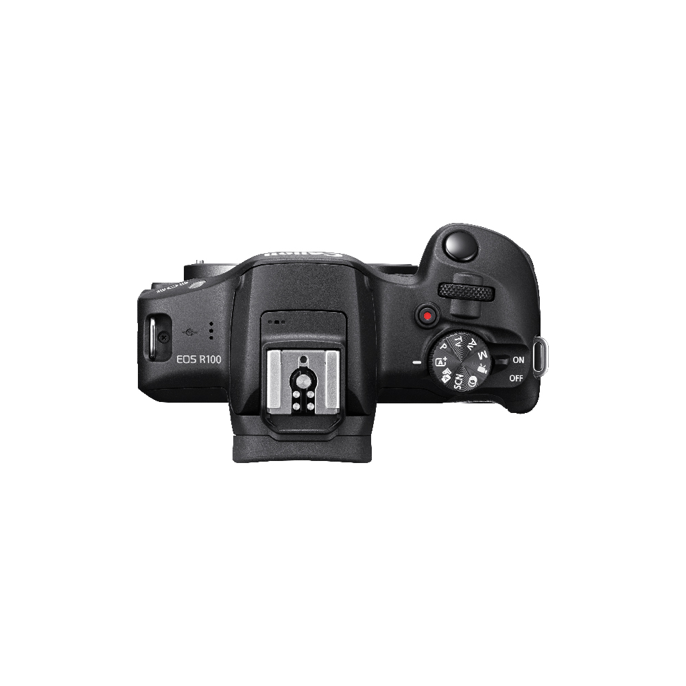 Siyah bir Canon EOS R100 kameranın yukarıdan görünümü, kontrolleri ve lens yuvasını gösteriyor.