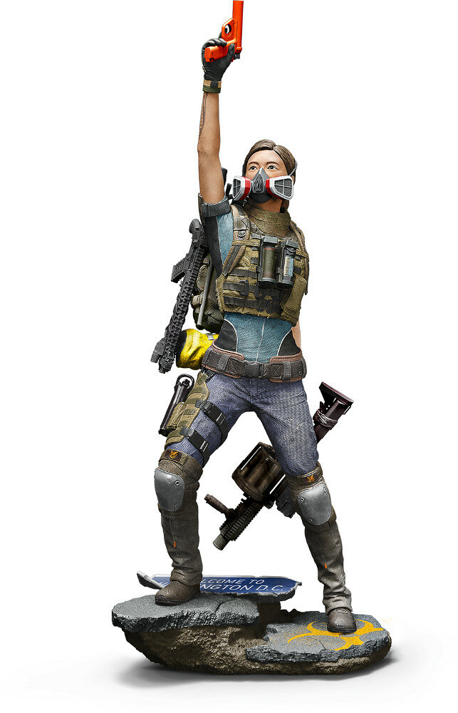 Statua kobiety w taktycznym ekwipunku, trzymającej broń w powietrzu, z maską gazową.