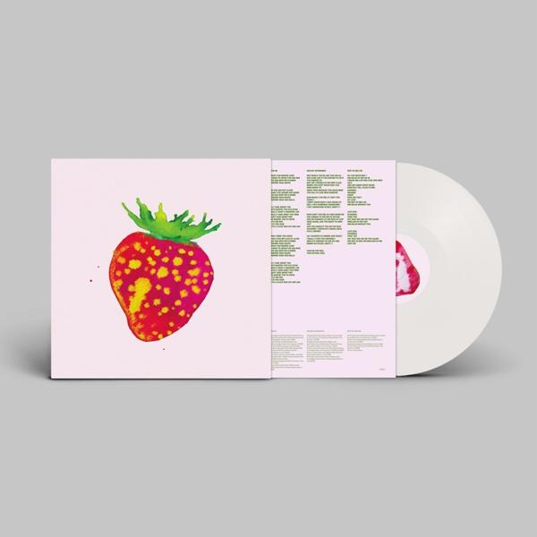 Pochette d'album. Une illustration de fraise sur fond rose. Paroles sur la pochette intérieure. Disque vinyle blanc à droite.