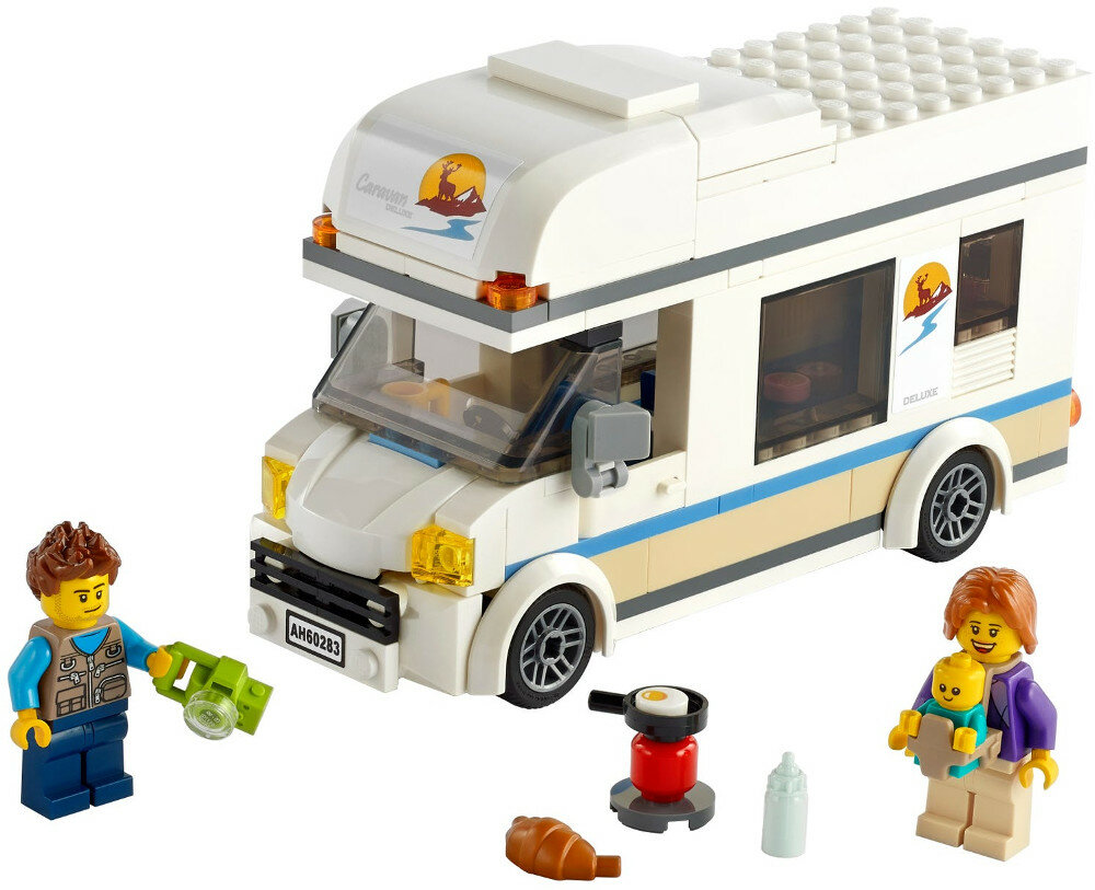Kamper Lego z figurkami i akcesoriami. Zawiera mężczyznę z latarką i kobietę z dzieckiem.