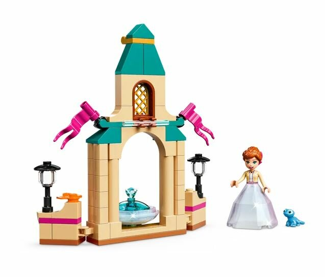 Zestaw Lego, budynek z kobietą i zwierzęciem domowym.