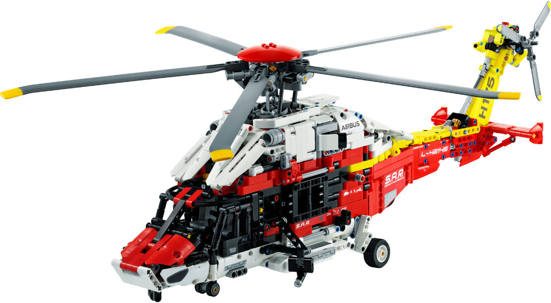 Model helikoptera Lego Technic. Jest czerwony, biały i żółty ze słowem Airbus.