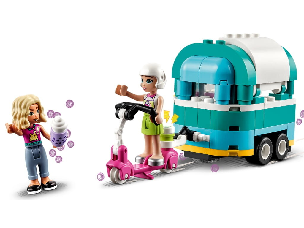 Zestaw Lego Friends. Dziewczyna na różowej hulajnodze, inna z napojem, przyczepa z turkusowym dachem.