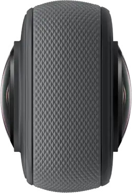 A black 360-degree camera with two lenses on a gray textured surface.