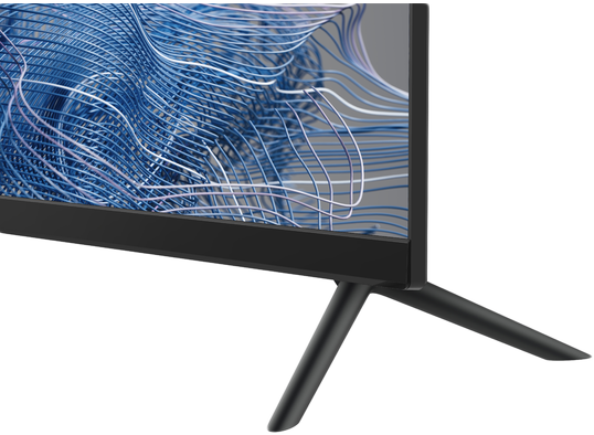 A TV talpának és állványának közeli képe. A képernyő kék és fehér hullámvonalakat jelenít meg.