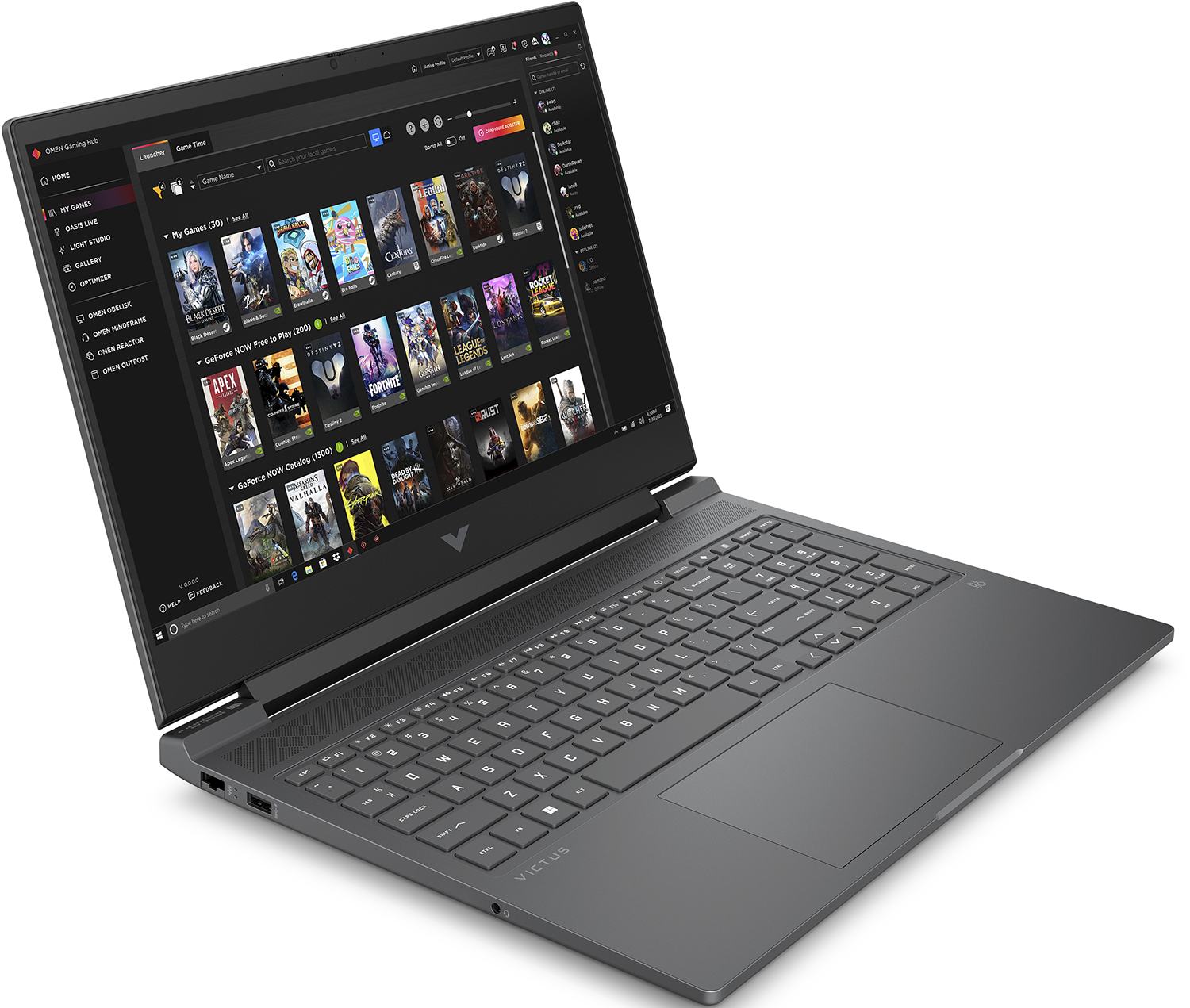 Un ordinateur portable gris affiche une bibliothèque de jeux sur son écran. Le clavier est visible et l'ordinateur est ouvert sur une surface blanche.