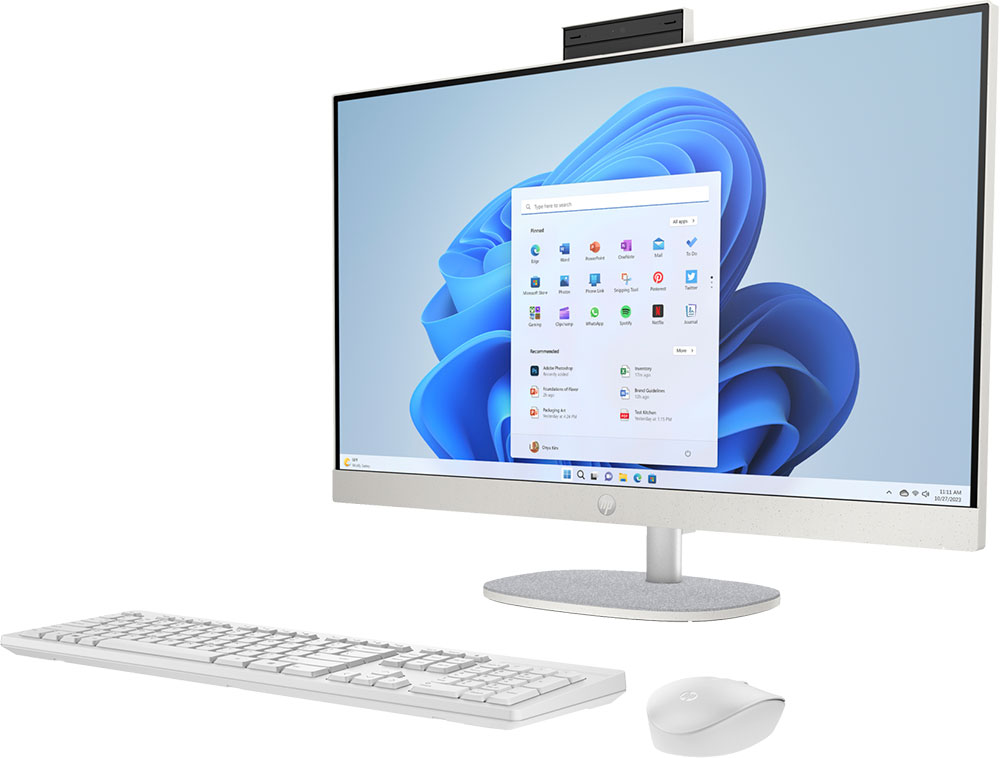 All-in-one computer met wit toetsenbord en muis. Het scherm toont Windows.