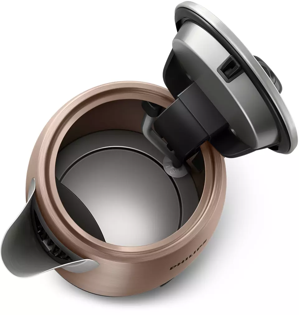 Czajnik w kolorze miedzi, otwarte wieczko. Widoczne wnętrze.