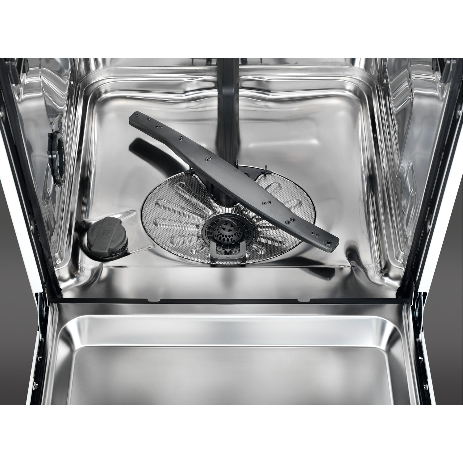 Interior of a dishwasher, showing the spray arms and filter. The interior is stainless steel.