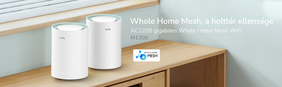 Két fehér, hengeres router egy faasztalon. Szöveg: Whole Home Mesh. AC1200 gigabit.