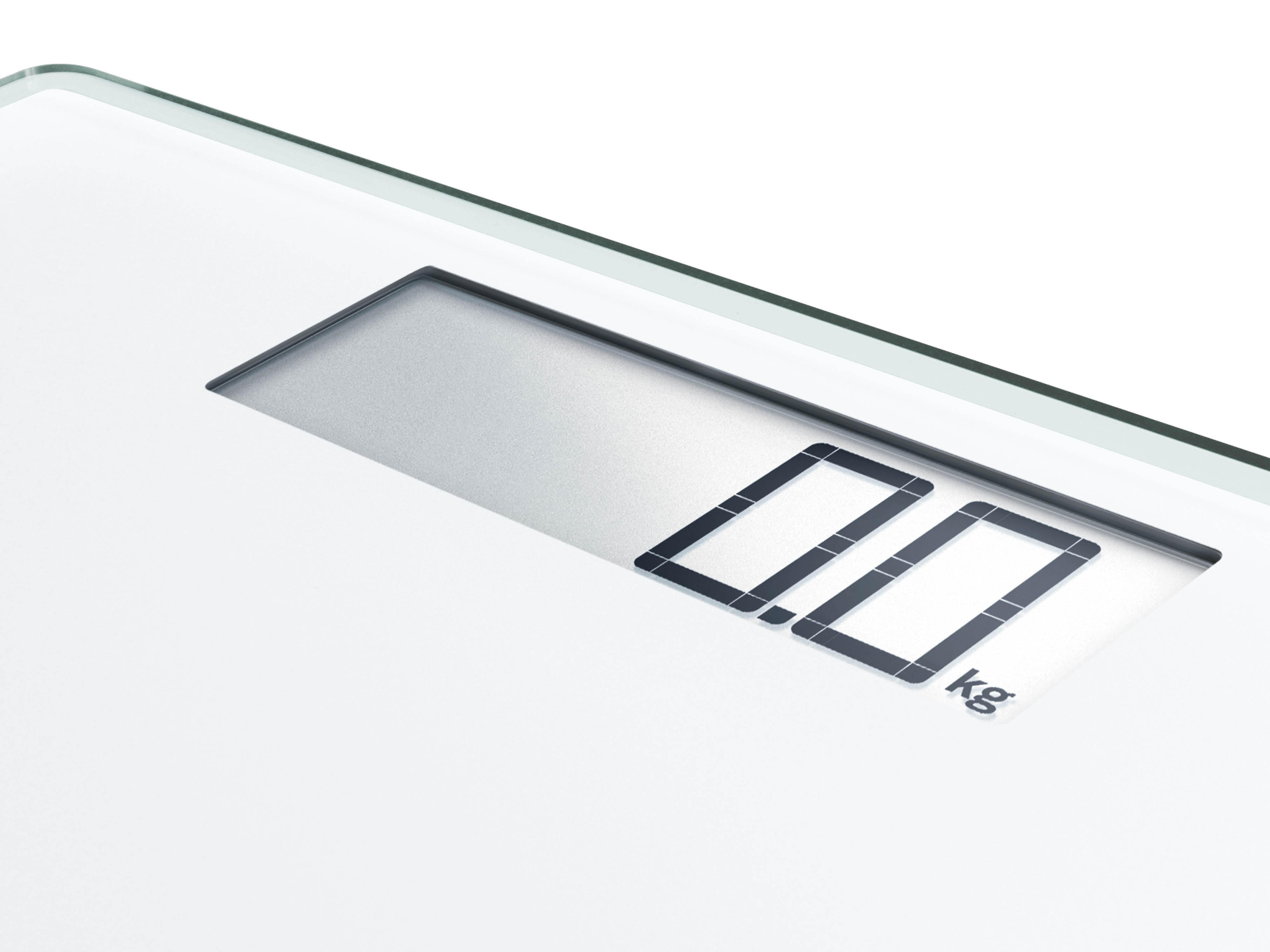 Eine Digitalwaage, die 0,0 kg anzeigt. Die Waage ist weiß mit einem silbernen Anzeigebereich.
