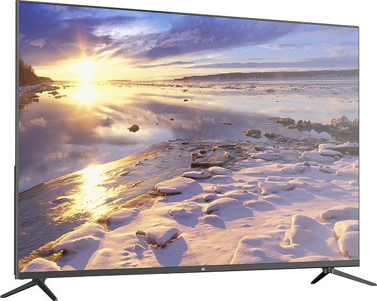 Ein Fernseher zeigt eine Winterlandschaft. Die Szene umfasst einen hellen Sonnenuntergang über einem verschneiten Ufer und eisigem Wasser. Der Fernseher ist schwarz mit Beinen.